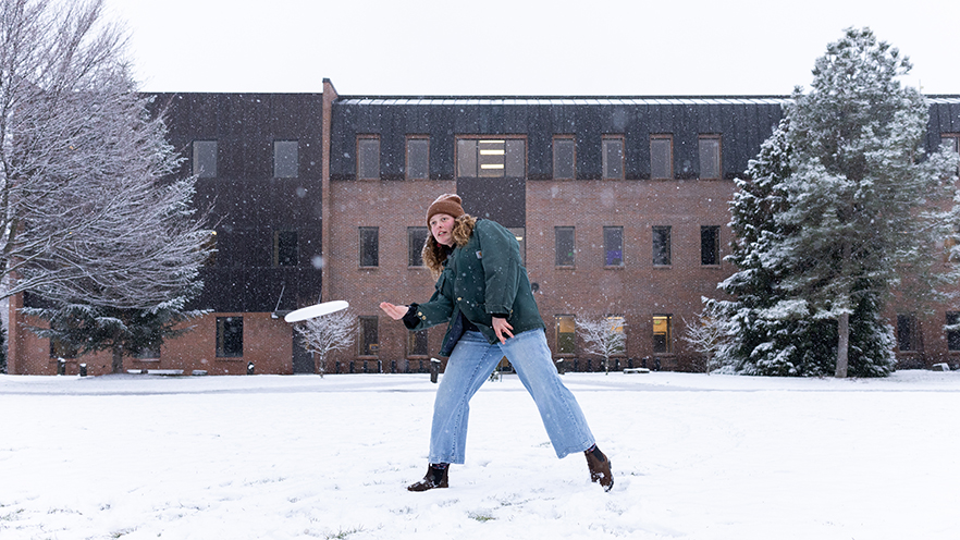Whitman student about to throw a snowball.
