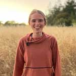 Renny Acheson standing in a wheat field