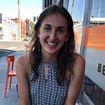 Chloe Michaels sitting at a table outdoors