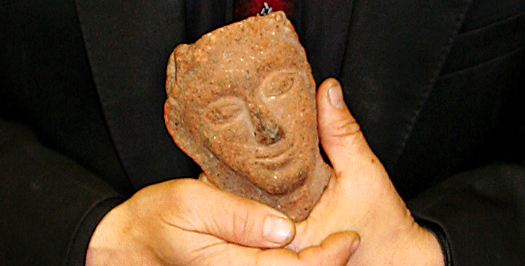 Photo of a human holding a artifact