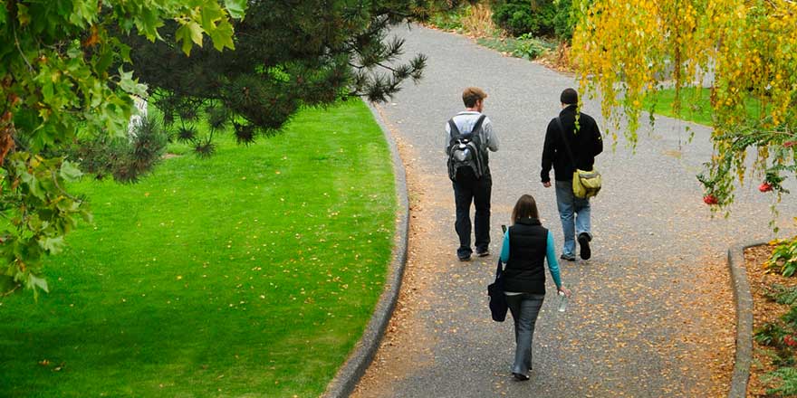 Whitman College students walking together with Fall colors