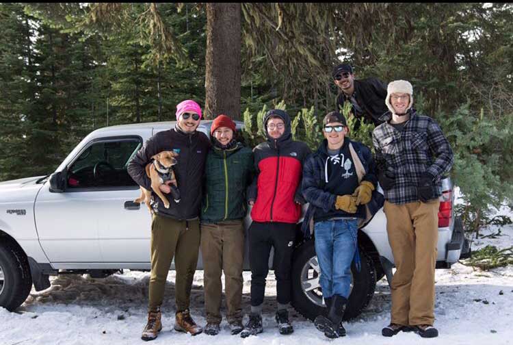 Sigma Chi members after cutting down a Christmas Tree