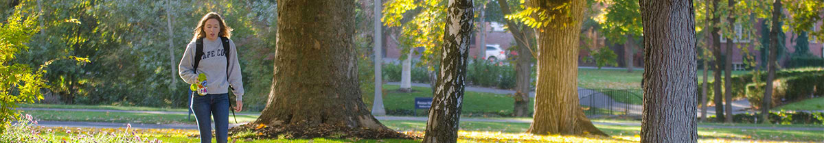 Student walking across campus