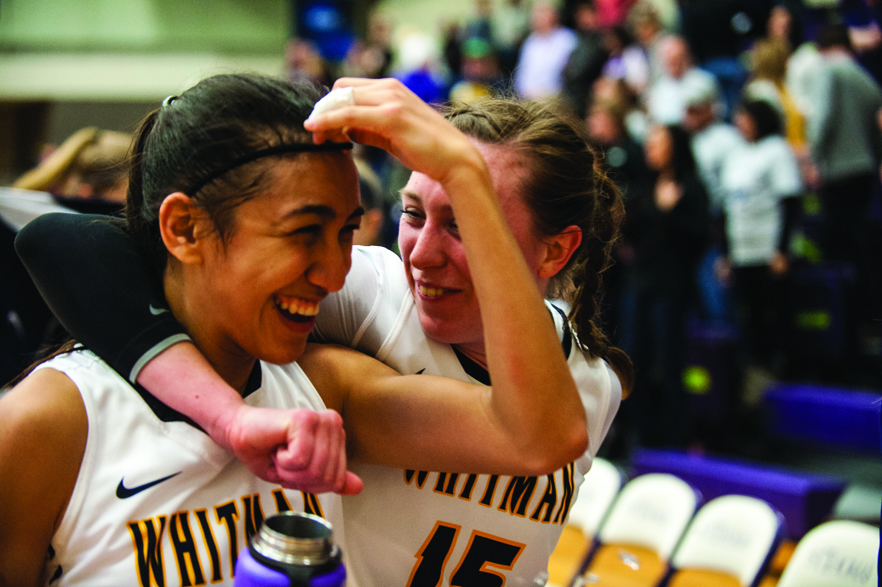 Guard and art major Casey Poe ’18 (left) and guard and economics major Alysse Ketner ’17 celebrate after the women’s team beats Trinity University in the NCAA  Division III Sweet 16 game in St. Paul.  Photo: Steve Woit.