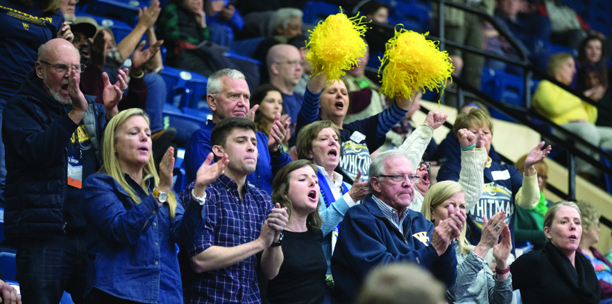 Whittie fans cheer the men’s basketball team during the  Final Four matchup against Babson College in Salem, Virginia, in March.