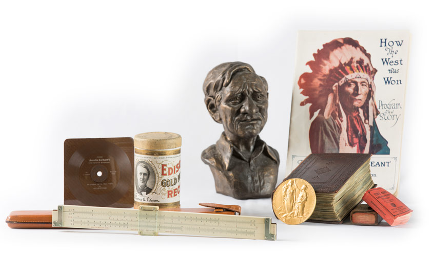 Collection containing the Nobel Prize awarded to Walter Brattain ’24, a bust of William O. Douglas ’20, a 1932 vinyl recording of Amelia Earhart and several publications, such as a How the West Was Won scrapbook.