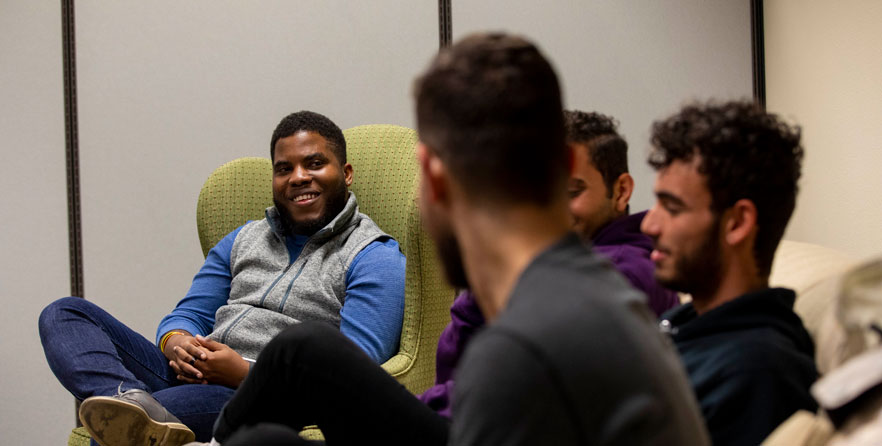 Jordan Crawford '21 listens to discussion during a meeting of Whitman's Men of Color Association.