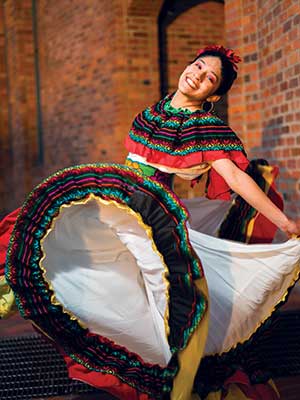 Neftali Segovia-Cruz posing in a dance costume