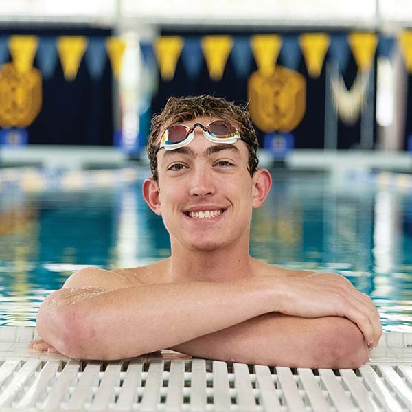 Tanner Filion ’23, smiling inside the pool.