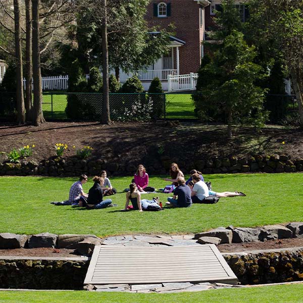 Students sitting outdoors.