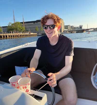 Aidan driving a boat