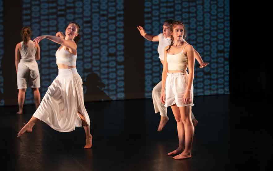 Dance students from Whitman College perform on stage.