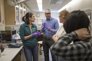 Assistant Professor of Chemistry Nate Boland explores ways to measure pH with students in his lab.