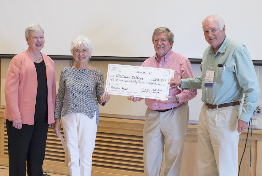 President Kathleen Murray (far left) receives a check worth almost $1.4 million from class of 1967 50th reunion fund chairs Leota Phillips Shaner (left), Dennis McNair (center) and Jim De Meules during a luncheon in Reid Campus Center Young Ballroom on May 19. 
