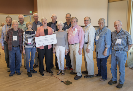 Class of 1967 co-chairs commemorate their $1 million gift with President Murray (holding check).