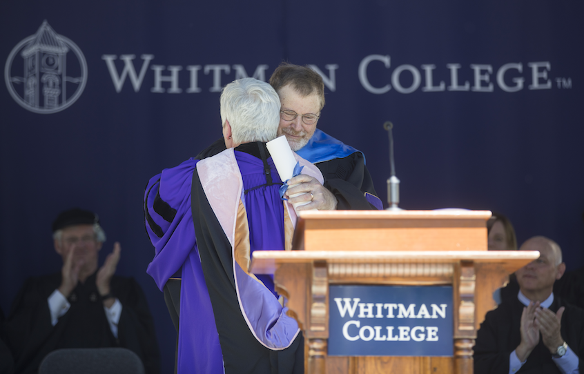 President Kathleen Murray embraces honorary degree recipient James Robart ’69, United States District Court Judge for the Western District of Washington. 