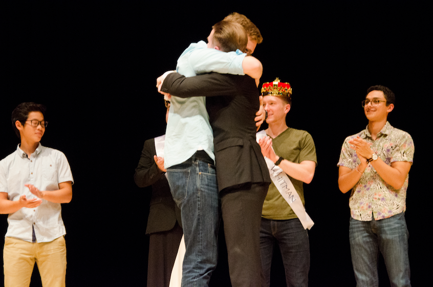 Winners Blair and Osborn embrace as fellow contestants cheer.