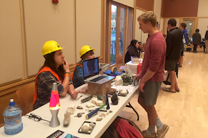 Chemistry and geology major Bryce Benson ’18 (left) and geology major Molly Coates ’17 represent the geology department at last year’s fair. Photo by Nora Leitch '18. 