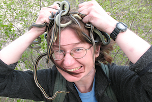 Kate Jackson holding snakes over her head