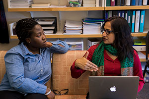 Laurinda Nyarko and Dalia Biswas go over research results.
