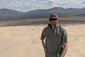 Lyman Persico stands in the Mojave Desert.