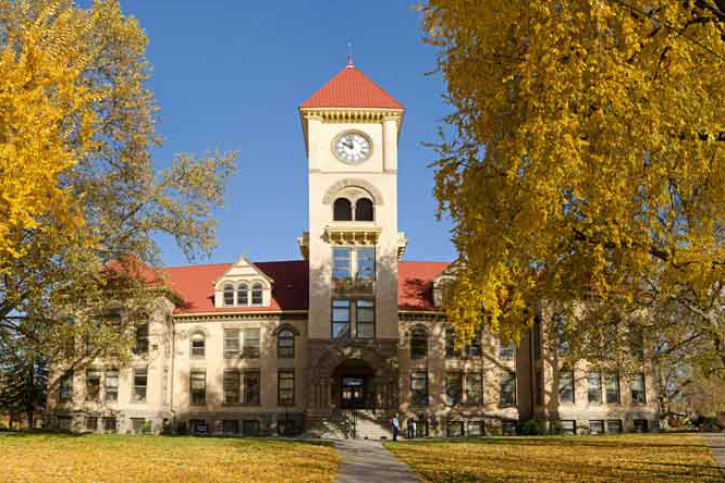 Whitman College's Memorial Building in the fall foliage.