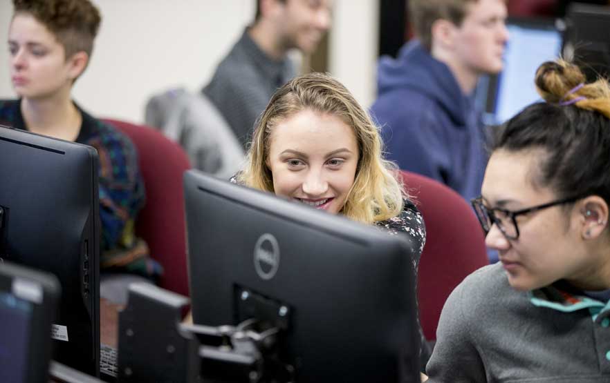 Computer science students working on a project.