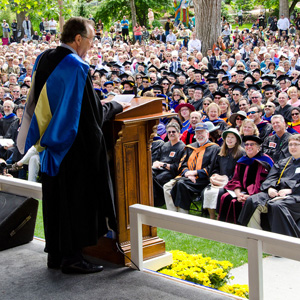 Eric Idle at the podium during Commencement 2013