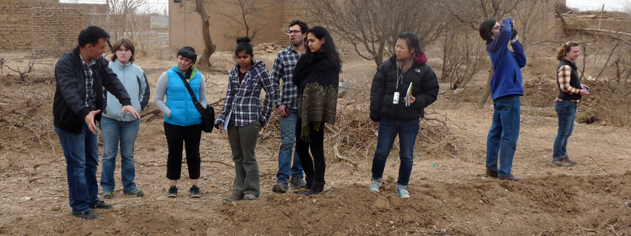 Professor teaching students outside