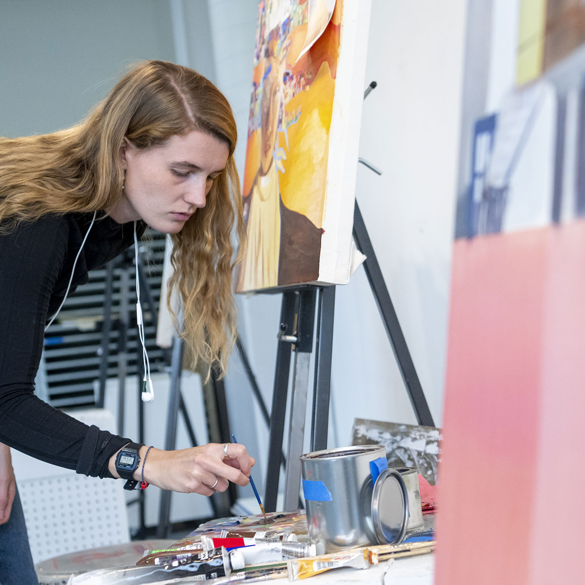 whitman college student painting in fouts center for the arts on whitman college campus