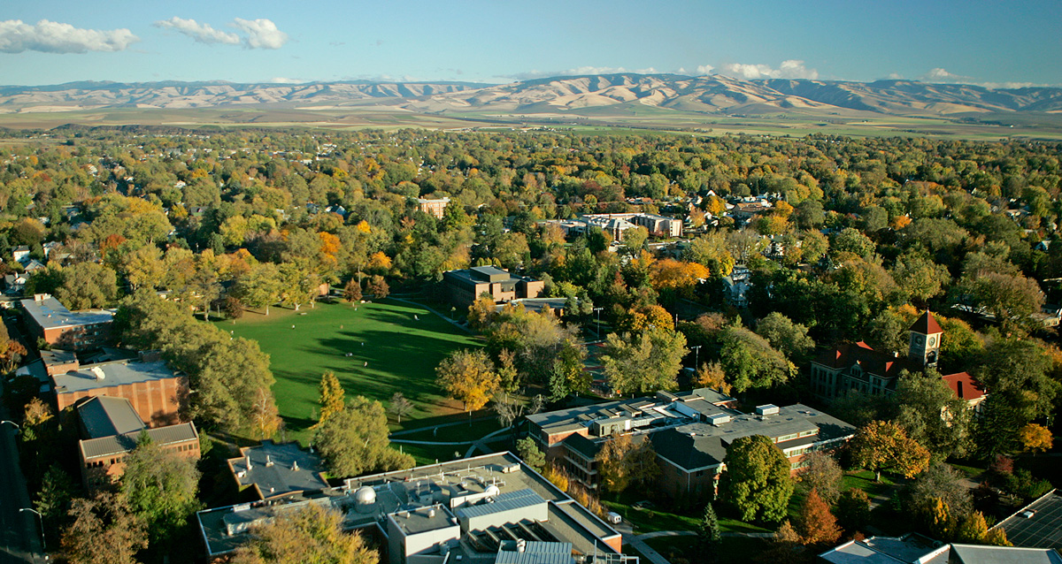 Drone shot of Whitman College campus with the Blue Mountains in the background.
