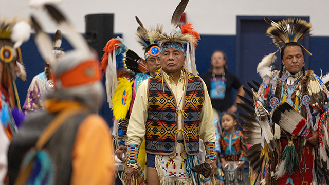 A group of Native Americans in traditional regalia.