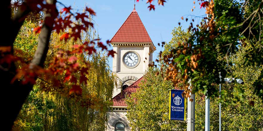 Whitman College's Memorial clock tower as seen through trees