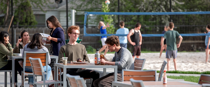 students eating outside Cleveland Commons