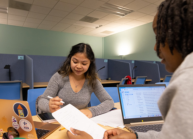 Academic Resource Center tutor helping student with their work.