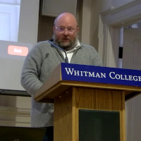 Man speaking from a lectern