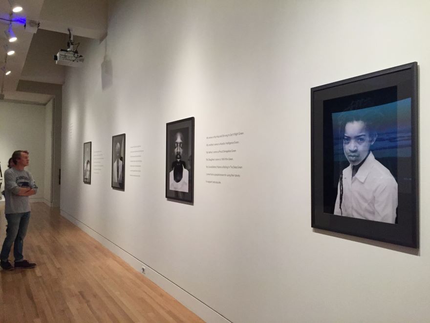 students observe artwork in a gallery