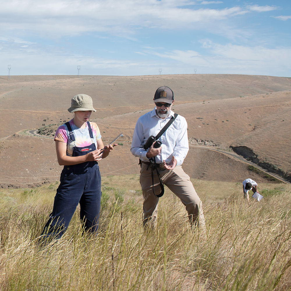 Teacher and student in the field.