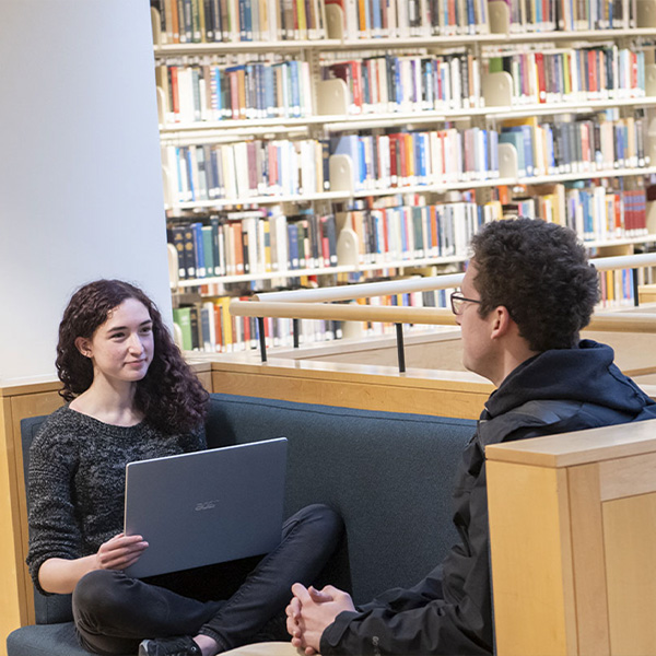 Students talking in the library.