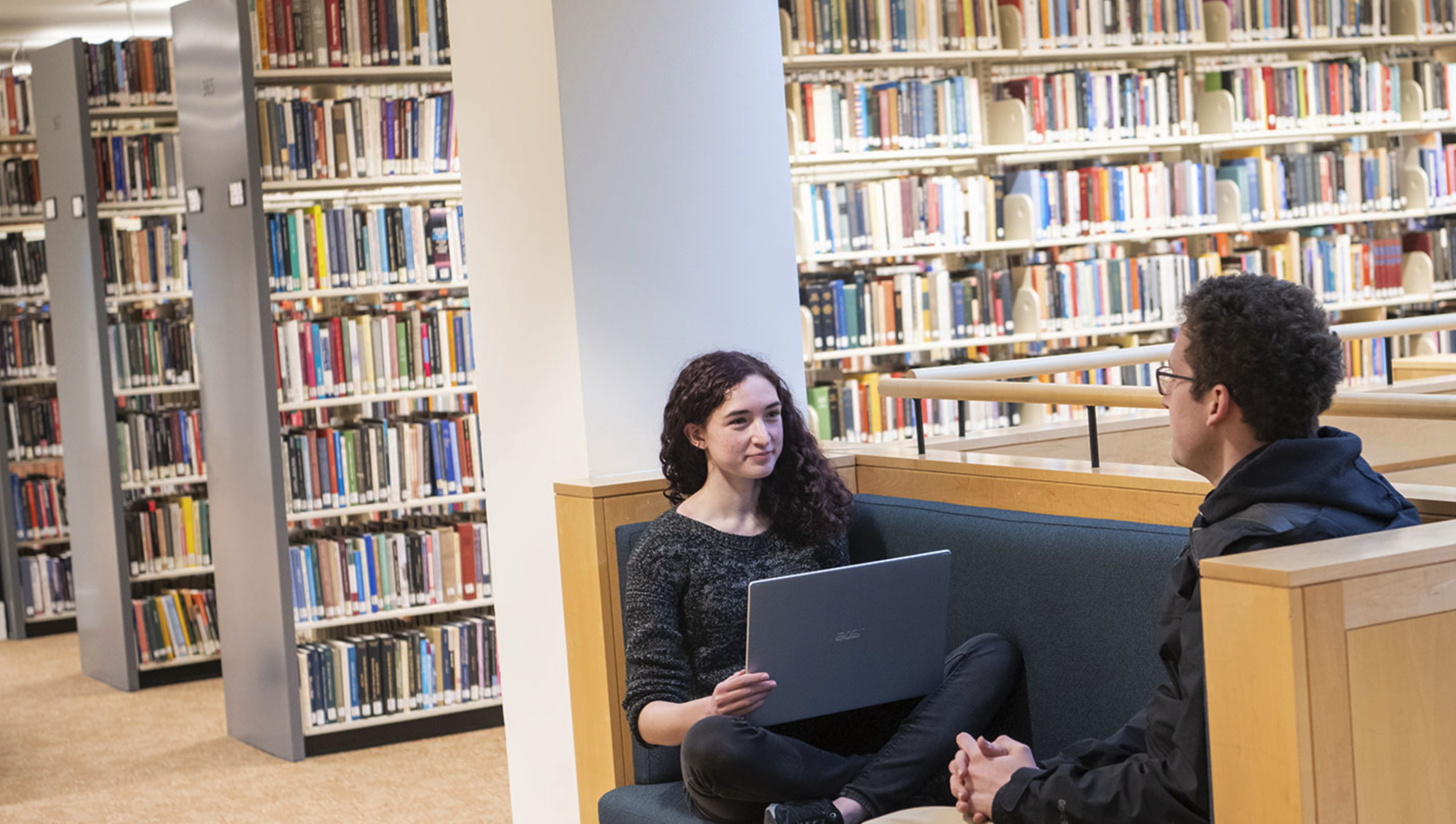 Students talking in the library.