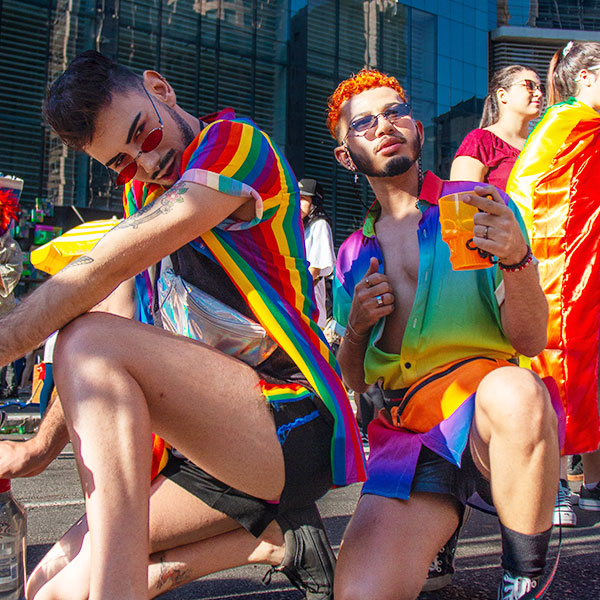 Two persons wearing colors representing LGBTQ+.