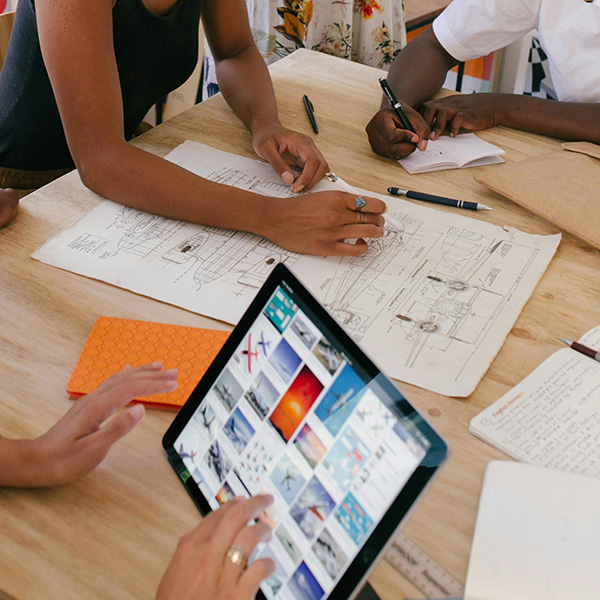 Group of women working on a design.