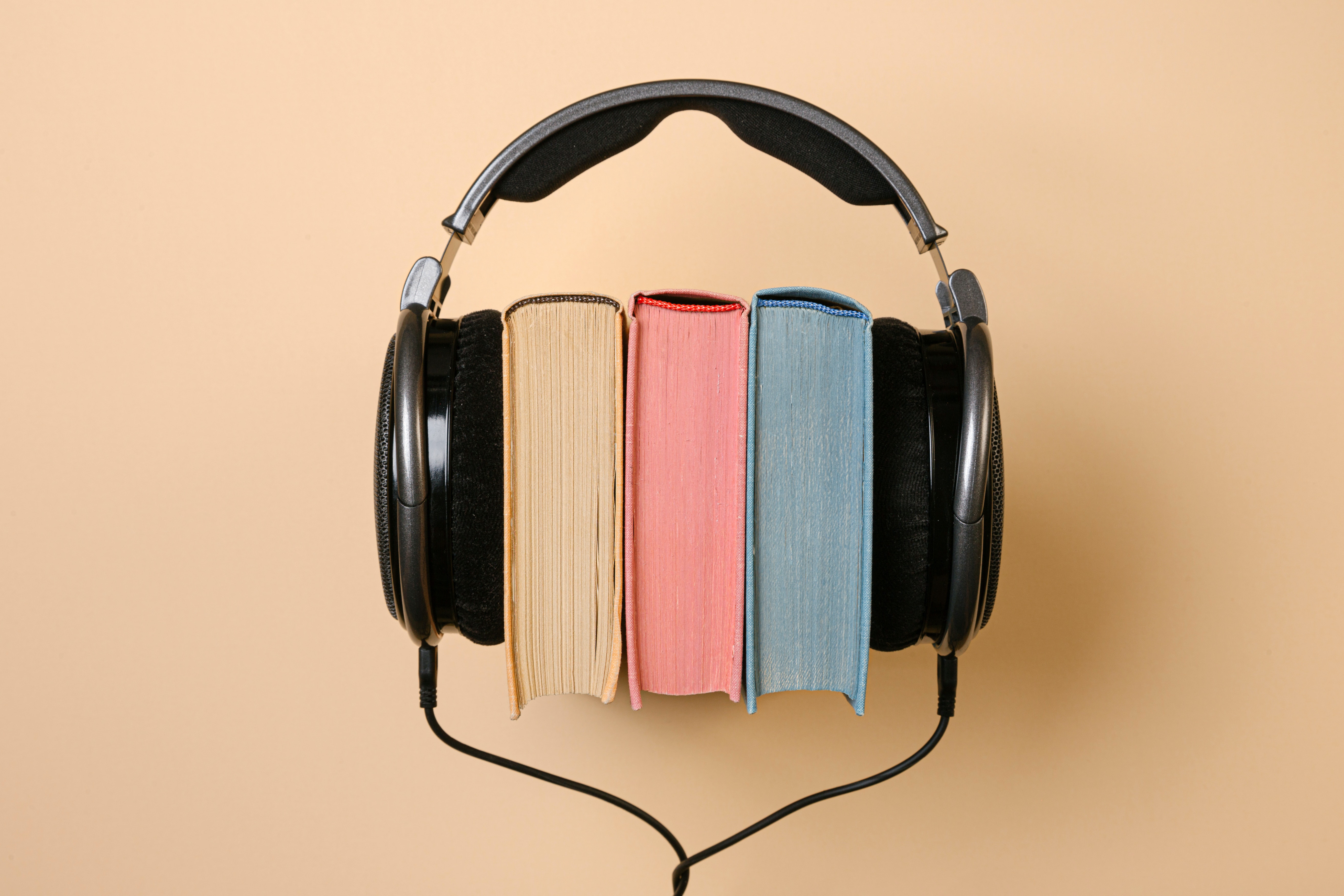 Headphones around some books.