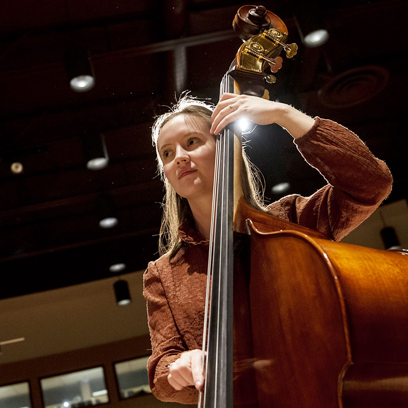 Student playing a cello.