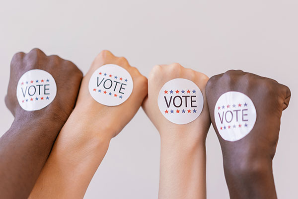 Political stickers on hands.