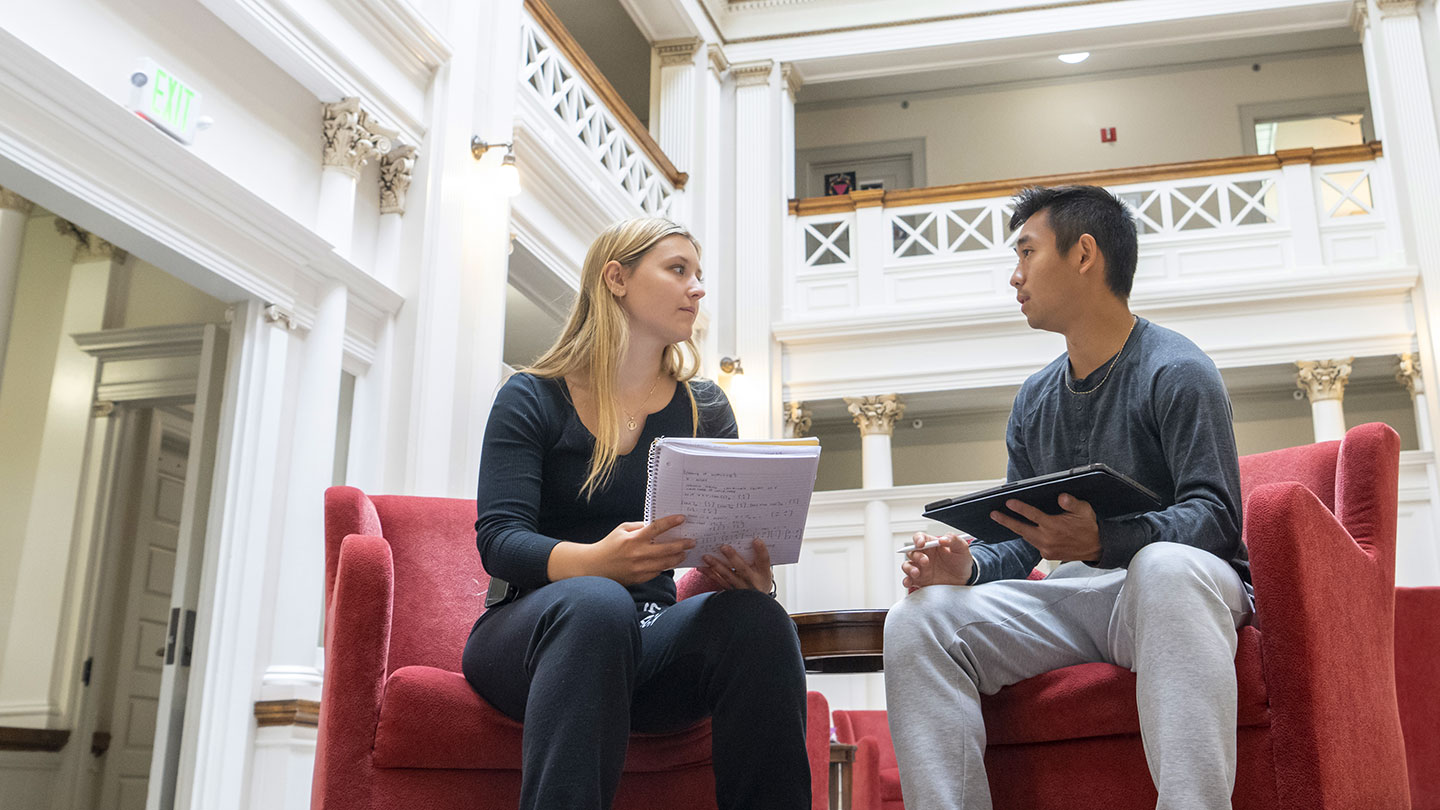 Student and teacher talking.