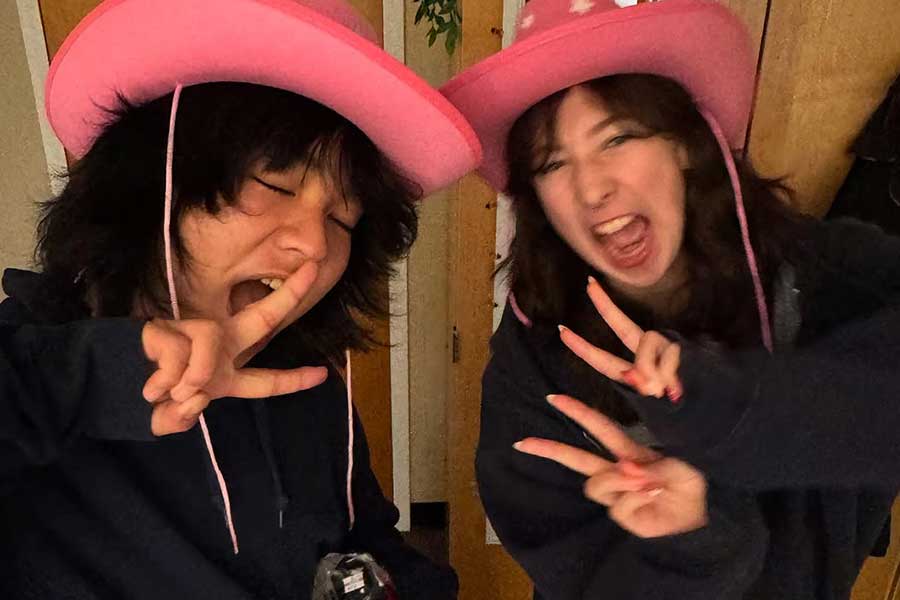 Pendhay Yeshay and a friend wearing pink cowboy hats.