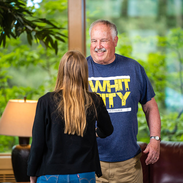 Jim Dow with a student in Reid Campus Center
