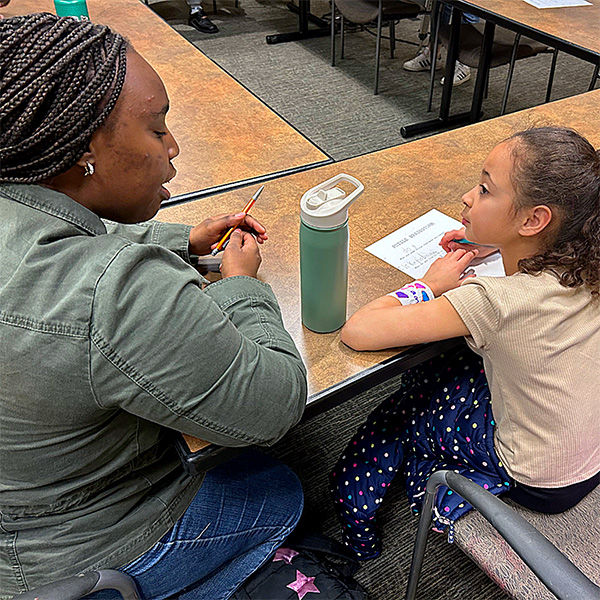 A Whitman student mentoring a Walla Walla Public School classroom.