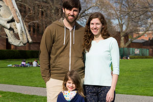 A portrait of Ben, Kate and Brienne VanDonge next to the Styx sculpture on Akeny Field.